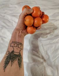Cropped hand of person holding fruit