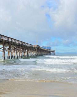 Pier over sea against sky