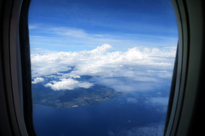 Aerial view of landscape seen through airplane window