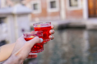 Close-up of hand holding drink