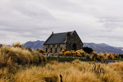 House on field against sky