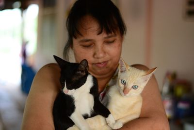 Portrait of woman with cat