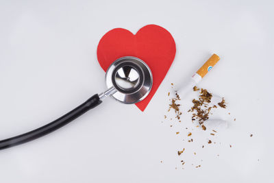 High angle view of heart shape on table against white background