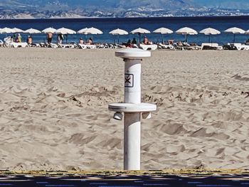 Group of people on beach by sea