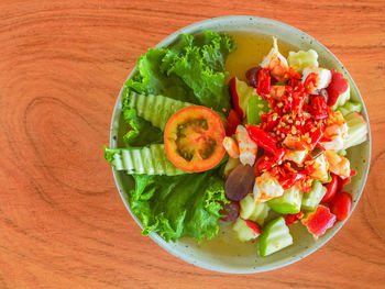 High angle view of chopped fruits in bowl on table