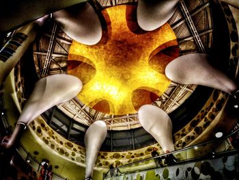 Directly below shot of illuminated ceiling in building