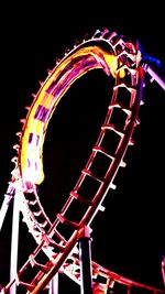Low angle view of illuminated ferris wheel