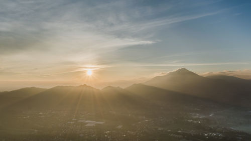 Scenic view of mountains against sky during sunset