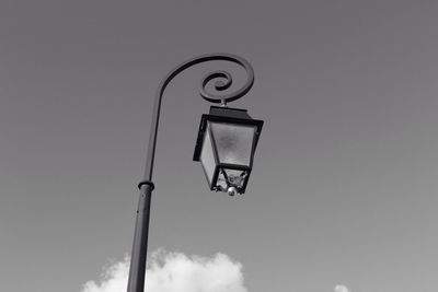 Low angle view of street lamp against sky