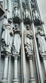 Low angle view of statue against building