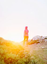 Rear view of woman against clear sky