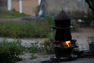 Old cooking pot stove using firewood as fuel.