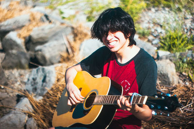 Young man playing guitar