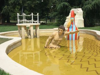 Boy playing in swimming pool