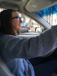 Woman sitting in car