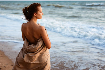 Woman standing at beach