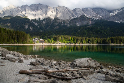 Scenic view of lake and mountains against sky