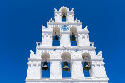Low angle view of church against blue sky