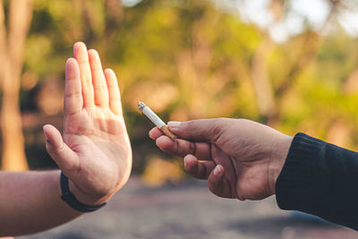 Close-up of man holding hands
