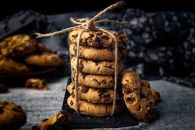 Close-up of handmade chocolate cookie tower tied with rope. cooking background