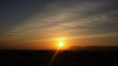 Scenic view of silhouette landscape against sky during sunset