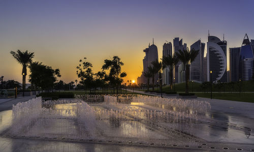 Panoramic view of city against sky during sunset
