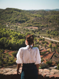 Rear view of man looking at mountain