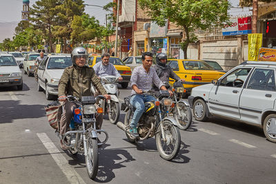 Bicycles parked on road in city