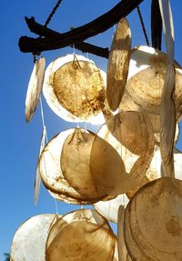 Low angle view of clothes hanging against sky