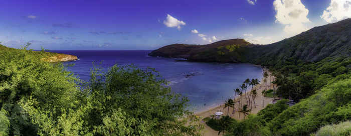 Panoramic view of sea and mountains against sky