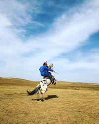 Man riding horse