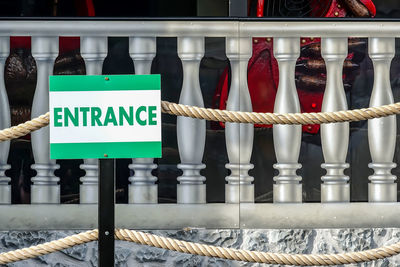 Close-up of text on railing
