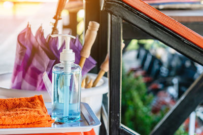 Close-up of man in glass bottle on table