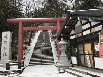 Staircase in park by building during winter