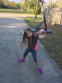 Portrait of girl playing with equipment in park