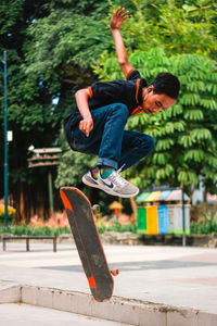 Full length of young man jumping