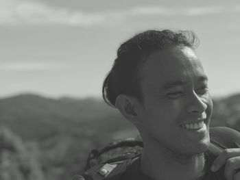 Close-up portrait of a smiling young man