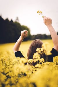 Close-up of woman holding flowers