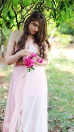 Beautiful young woman with flowers