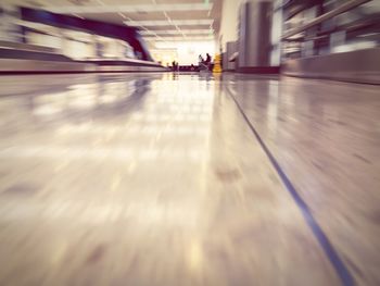 Blurred motion of people walking in city