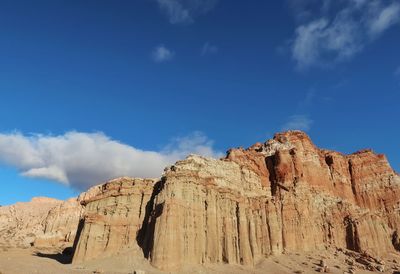 Low angle view of rock formations against sky