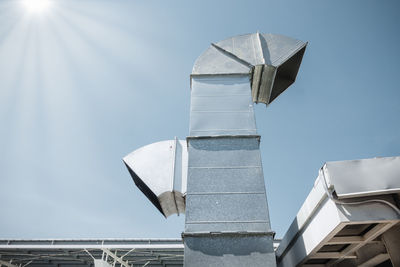 Low angle view of windmill against sky