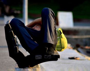 Man sitting on seat in park