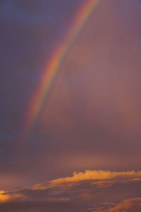 Low angle view of cloudy sky at sunset