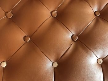 Full frame shot of illuminated lighting equipment on ceiling