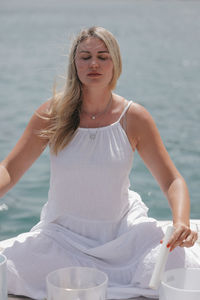 Portrait of young woman in sea