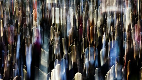 Blurred motion of crowd on city street