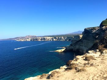 Scenic view of sea against blue sky