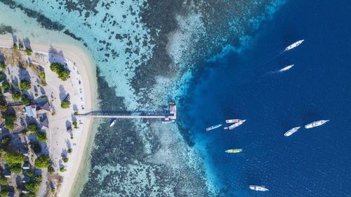 Aerial view of boats moored at harbor