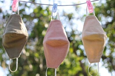 Low angle view of lanterns hanging on clothesline